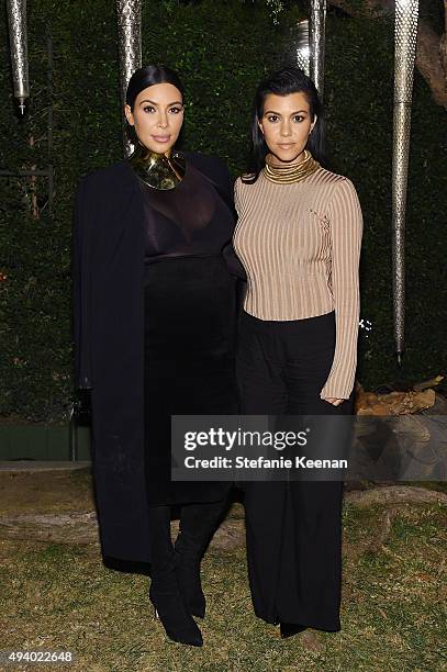 Kim Kardashian West and Kourtney Kardashian attend Olivier Rousteing & Beats Celebrate In Los Angeles at Private Residence on October 23, 2015 in Los...