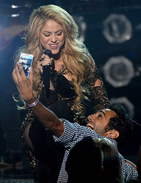 Fan takes a selfie as singer Shakira performs during the 2014 Billboard Music Awards at the MGM Grand Garden Arena on May 18, 2014 in Las Vegas,...