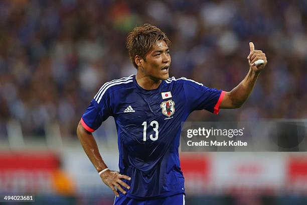Yoshito Okubo gestures to a team mate during the Kirin Challenge Cup international friendly match between Japan and Cyprus at Saitama Stadium on May...