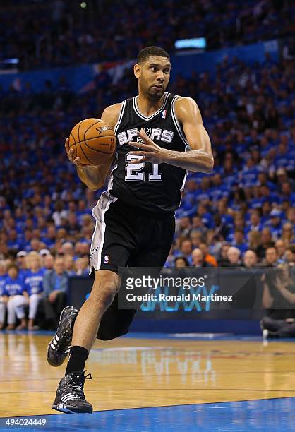 Tim Duncan of the San Antonio Spurs drives to the basket in the first half against the Oklahoma City Thunder during Game Three of the Western...