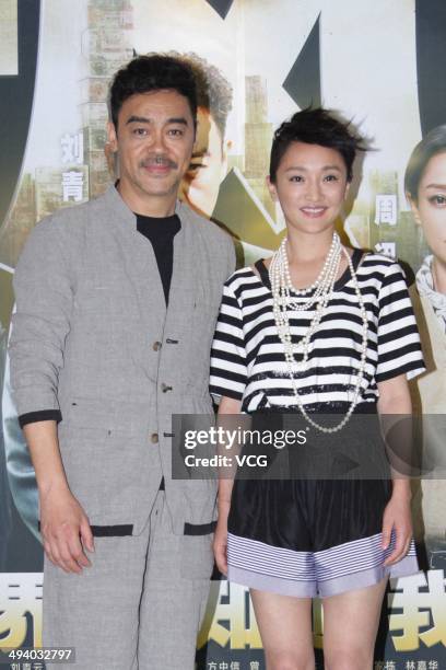 Actress Zhou Xun and actor Lau Ching-Wan attend "Overheard 3" premiere at Tsinghua University on May 27, 2014 in Beijing, China.