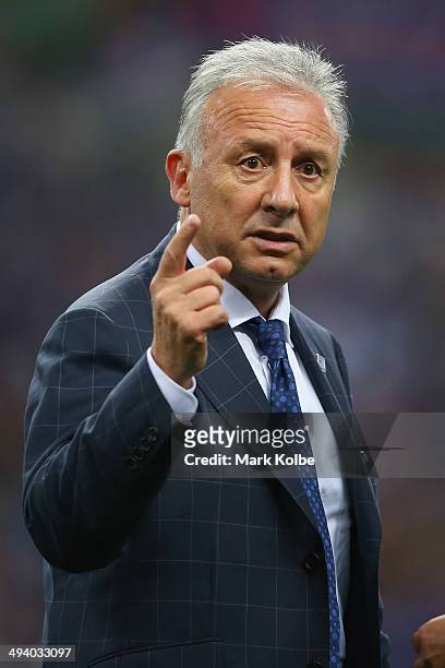 Japan coach Alberto Zaccheroni gestures as he speaks to a member of his coaching staff after the Kirin Challenge Cup international friendly match...