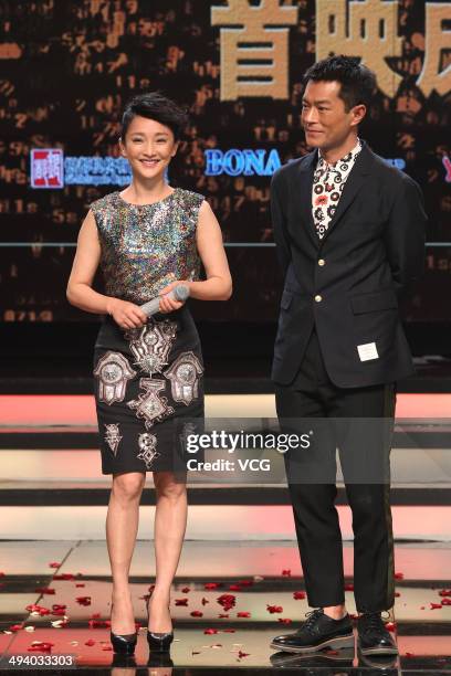 Actress Zhou Xun and actor Louis Koo attend "Overheard 3" premiere at Tsinghua University on May 27, 2014 in Beijing, China.