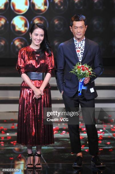 Actress Michelle Ye and actor Louis Koo attend "Overheard 3" premiere at Tsinghua University on May 27, 2014 in Beijing, China.