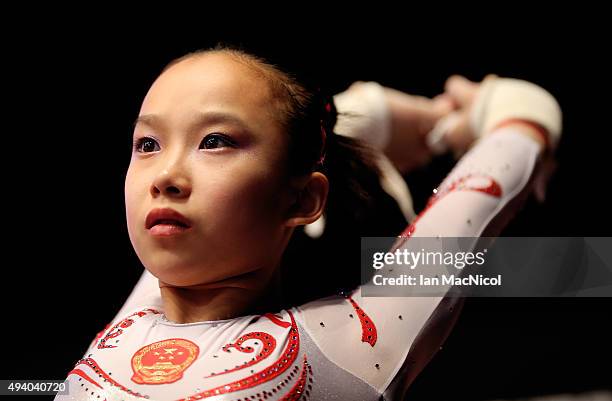 Tan Jiaxin of China prepares for the Uneven Bars during day Two of the 2015 World Artistic Gymnastics Championships at The SSE Hydro on October 24,...