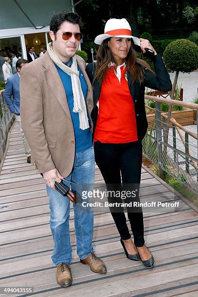 Host Karine Ferry and her brother David ferry attend the Roland Garros French Tennis Open 2014 - Day 3 on May 27, 2014 in Paris, France.