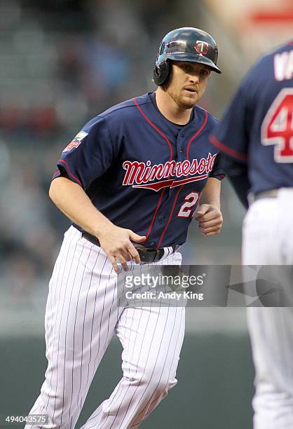 Chris Parmelee of the Minnesota Twins rounds the bases after a home run by teammate Eduardo Nunez of the Minnesota Twins second inning against the...