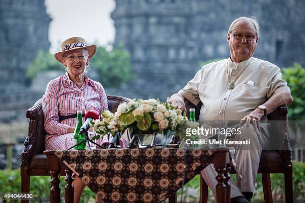 Queen Margrethe II of Denmark and her husband, Prince Henrik talk to journalist during their visit at Prambanan temple on October 24, 2015 in...