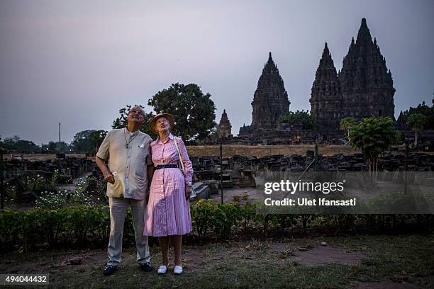Queen Margrethe II of Denmark and her husband, Prince Henrik, pose for a photo during their visit at Prambanan temple on October 24, 2015 in...
