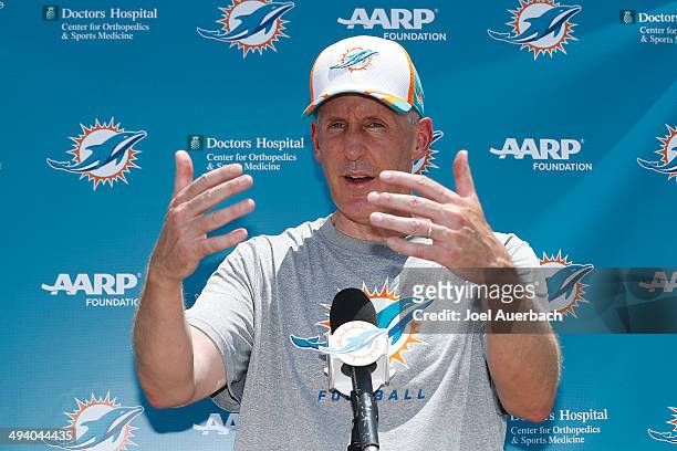 Head coach Joe Philbin of the Miami Dolphins talks to the media after the teams first OTA on May 27, 2014 at the Miami Dolphins training facility in...