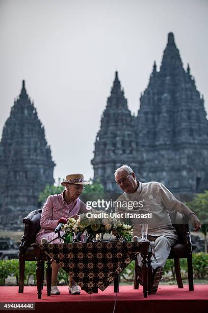 Queen Margrethe II of Denmark and her husband, Prince Henrik talk to journalist during their visit at Prambanan temple on October 24, 2015 in...