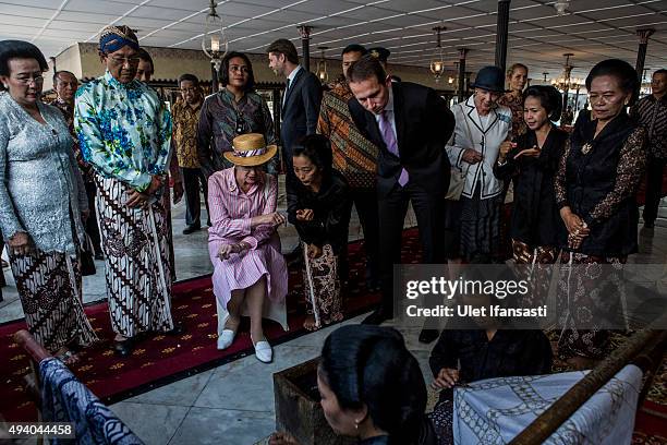 Danish Queen Margrethe II , listens as she watches the process of making batik during meets with Sri Sultan Hamengkubuwono X as her visit at Kraton...