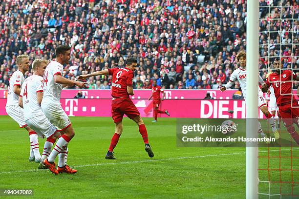Robert Lewandowski of Muenchen scores the 3rd team goal during the Bundesliga match between FC Bayern Muenchen and 1. FC Koeln at Allianz Arena on...