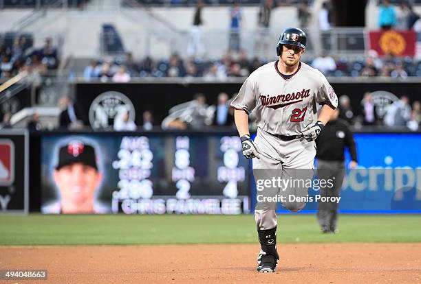 Chris Parmelee of the Minnesota Twins rounds the bases after hitting a solo home run during the second inning of a baseball game against the San...