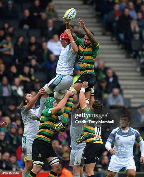 Courtney Lawes of Northampton Saints wins the ball from Mouritz Botha of Newcastle Falcons in the line out during the Aviva Premiership match between...