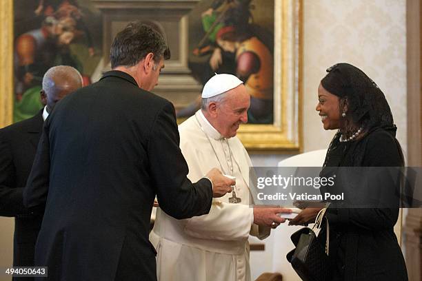 Pope Francis exchanges gifts with the president of the Republic of Angola, Jose Eduardo Dos Santos and his wife Ana Paula Dos Santos during an...