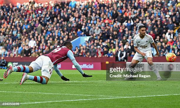 Jordan Ayew of Aston Villa scores his team's first goal during the Barclays Premier League match between Aston Villa and Swansea City at Villa Park...