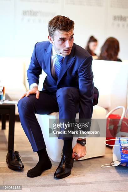 Jules Bianchi of France and Marussia prepares to take part in the Amber Lounge Fashion Show ahead of the Monaco Formula One Grand Prix at Circuit de...