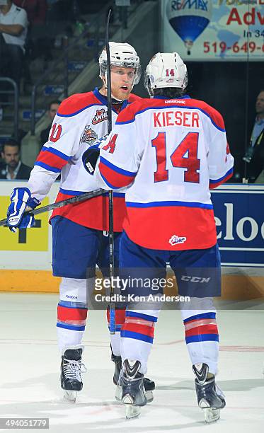Henrik Samuelsson of the Edmonton Oil Kings talks over a play with teammate Riley Keiser prior to a faceoff against the Guelph Storm in the final of...
