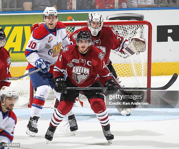 Henrik Samuelsson of the Edmonton Oil Kings looks for a shot to tip between Justin Nichols and Matt Finn of the Guelph Storm in the final of the 2014...