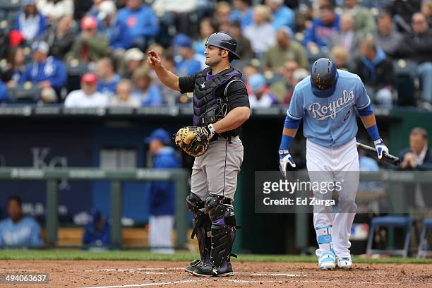 Michael McKenry of the Colorado Rockies signals the infield during a game against the Kansas City Royals at Kauffman Stadium on May 14, 2014 in...