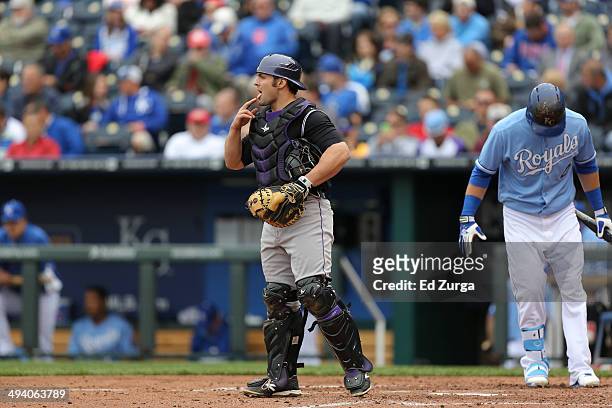 Michael McKenry of the Colorado Rockies signals the infield during a game against the Kansas City Royals at Kauffman Stadium on May 14, 2014 in...