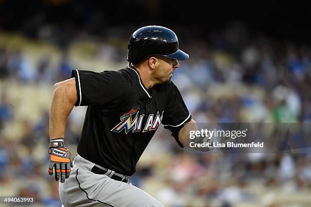 Reed Johnson of the Miami Marlins runs to first base after hitting a single in the second inning against the Los Angeles Dodgers at Dodger Stadium on...