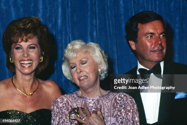 Actress Stefanie Powers and actor Robert Wagner present actress Barbara Stanwyck with award for Outstanding Lead Actress in a Limited Series or...