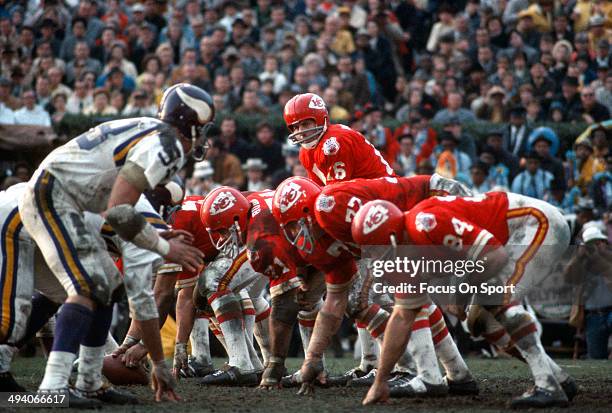 Len Dawson of the Kansas City Chiefs stands under center and calls out the signals against the Minnesota Vikings during Super Bowl IV on January 11,...