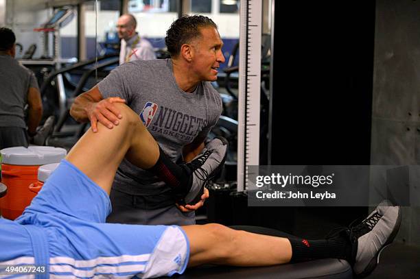 Denver Nuggets assistant coach/strength and conditioning Steve Hess works on Danilo Gallinari before his workout in the training room. Denver Nuggets...