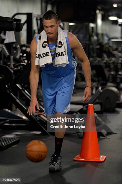 Denver Nuggets Danilo Gallinari dribbles a basketball while balancing on one leg as he goes through a rigorous workout May 27, 2014 at Pepsi Center....