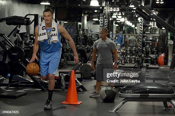 Denver Nuggets Danilo Gallinari dribbles a basketball while balancing on one leg as he goes through a rigorous workout May 27, 2014 at Pepsi Center....