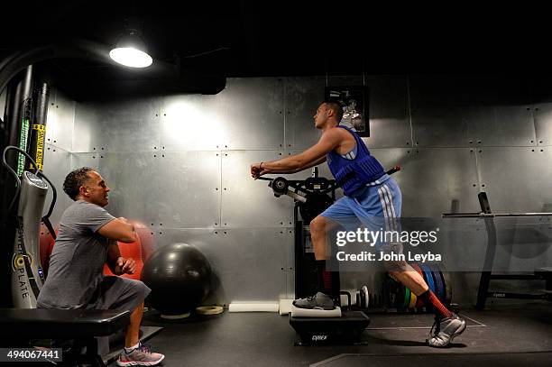 Denver Nuggets Danilo Gallinari is carefully watched by assistant coach/strength and conditioning Steve Hess May 27, 2014 at Pepsi Center. Gallinari...