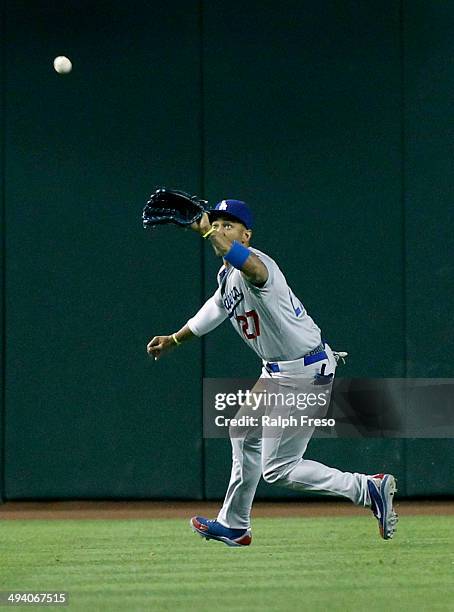 Matt Kemp of the Los Angeles Dodgers chases down a fly ball against the Arizona Diamondbacks during the seventh inning of a MLB game at Chase Field...