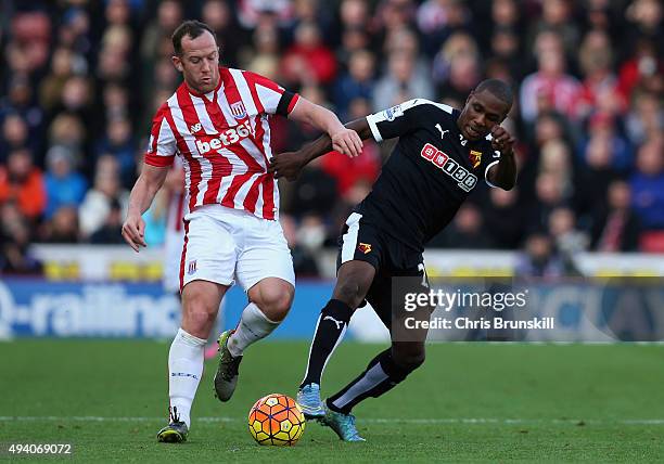 Charlie Adam of Stoke City and Odion Ighalo of Watford compete for the ball during the Barclays Premier League match between Stoke City and Watford...