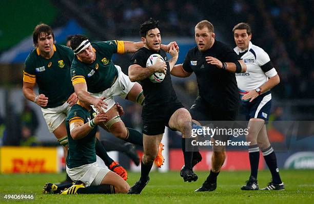 Nehe Milner-Skudder of the New Zealand All Blacks escapes the tackles of Francois Louw of South Africa during the 2015 Rugby World Cup Semi Final...