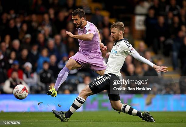 Orlando Sa of Reading scores his team's second goal of the game under pressure from Tim Ream of Fulham during the Sky Bet Championship match between...