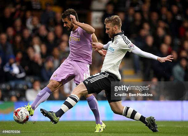Orlando Sa of Reading scores his team's second goal of the game under pressure from Tim Ream of Fulham during the Sky Bet Championship match between...