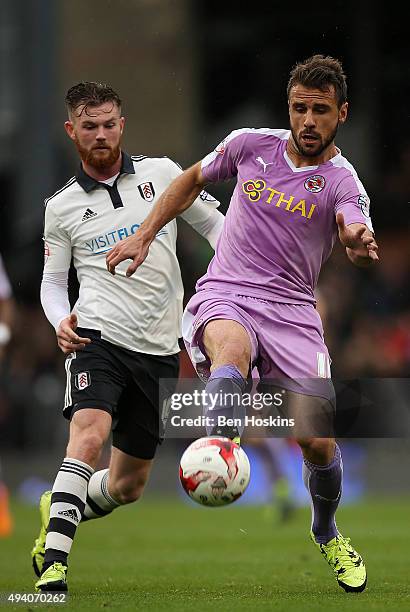 Orlando Sa of Reading advances under pressure from Ryan Tunnicliffe of Fulham during the Sky Bet Championship match between Fulham and Reading on...