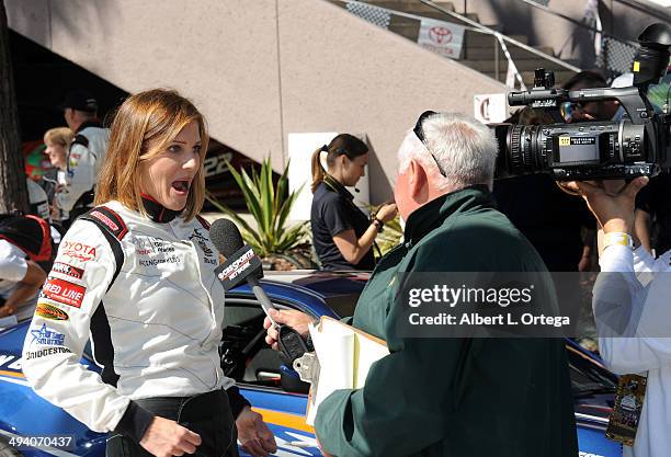 Actress Tricia Helfer participates in the 37th Annual Toyota Pro/Celebrity Race - Day 1 held on the streets of Long Beach on April 11, 2014 in Long...