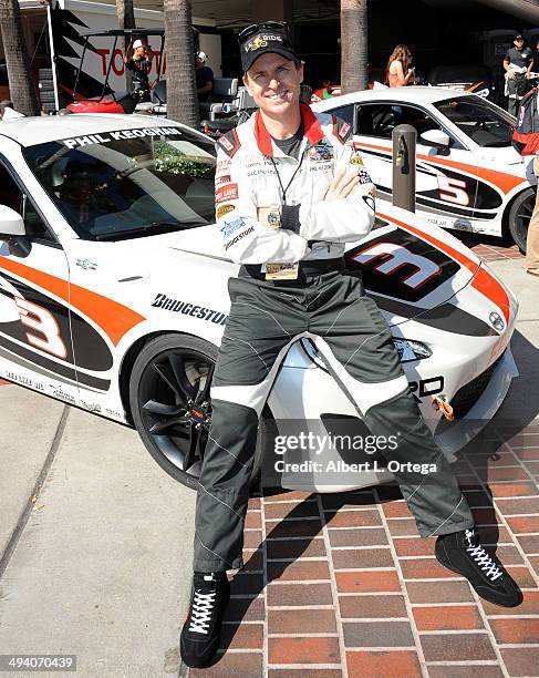 Personality Phil Keoghan participates in the 37th Annual Toyota Pro/Celebrity Race - Day 1 held on the streets of Long Beach on April 11, 2014 in...