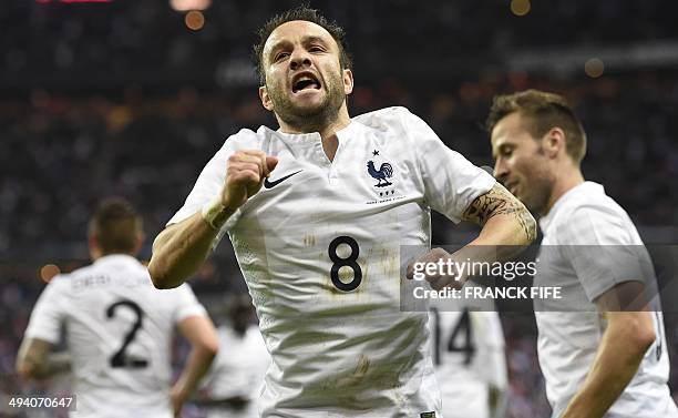 France's forward Mathieu Valbuena celebrates after scoring a goal during a friendly football match between France and Norway at the Stade de France...