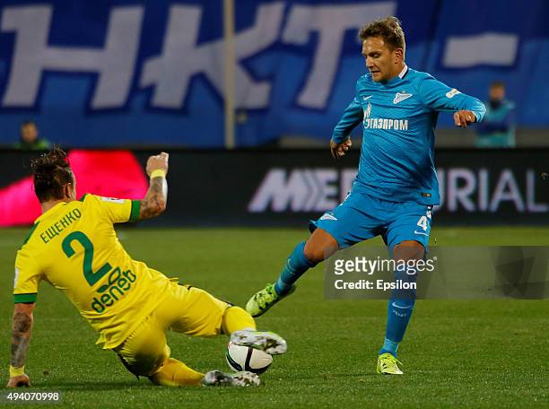 Domenico Criscito of FC Zenit St. Petersburg and Andrey Yeshchenko of FC Anzhi Makhachkala vie for the ball during the Russian Football League match...