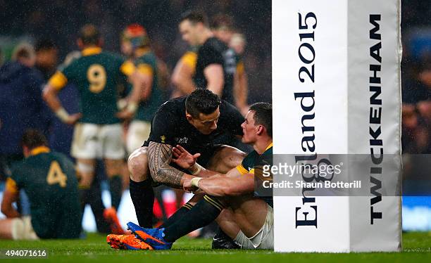 Jesse Kriel of South Africa is consoled by Sonny Bill Williams of the New Zealand All Blacks at the end of the match during the 2015 Rugby World Cup...