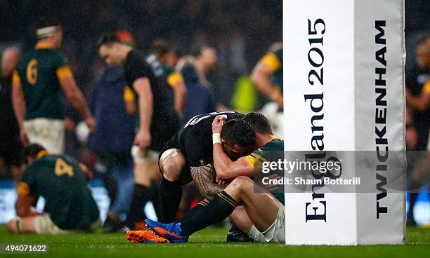 Jesse Kriel of South Africa is consoled by Sonny Bill Williams of the New Zealand All Blacks at the end of the match during the 2015 Rugby World Cup...