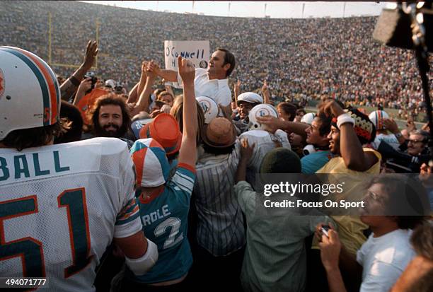 Head Coach Don Shula of the Miami Dolphins gets carried off the field by his players after they defeated the Washington Redskins in Super Bowl VII at...