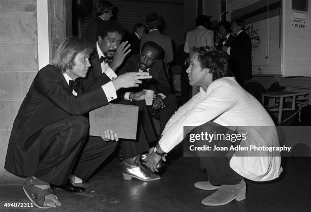 Actor Jon Voight, stand-up comedian and actor Richard Pryor, Unidentified and comedian actor Chevy Chase backstage during a tribute to Muhammad Ali...