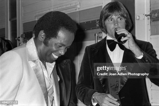 Recording artist and actor Lou Rawls with athlete and TV personality Bruce Jenner backstage during a tribute to Muhammad Ali celebration at the Forum...