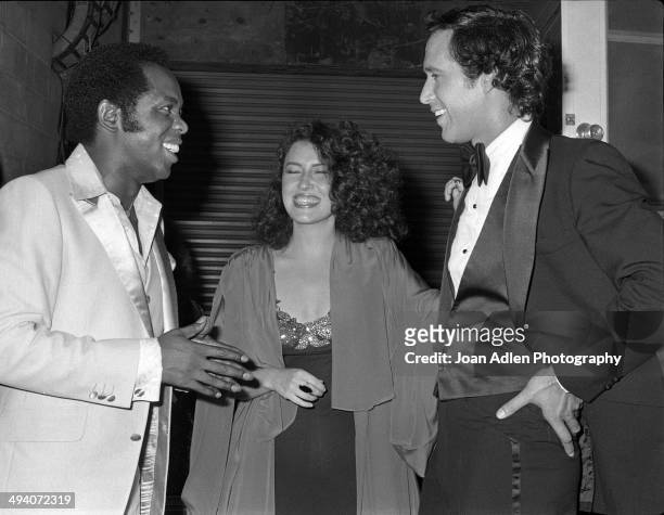 Recording artist and actor Lou Rawls with singer-songwriter Melissa Manchester and comedian actor Chevy Chase backstage during a tribute to Muhammad...