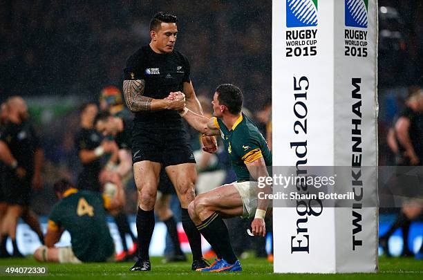 Sonny Bill Williams of the New Zealand All Blacks consoles Jesse Kriel of South Africa at the end of the match during the 2015 Rugby World Cup Semi...